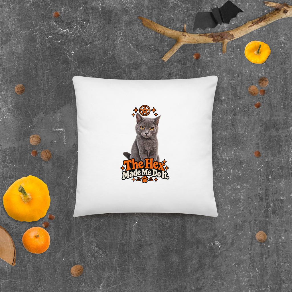 Uno the Cat Halloween pillow with a gray cat, orange magical symbol, and funny slogan, photographed against a dark textured background with seasonal pumpkins.
