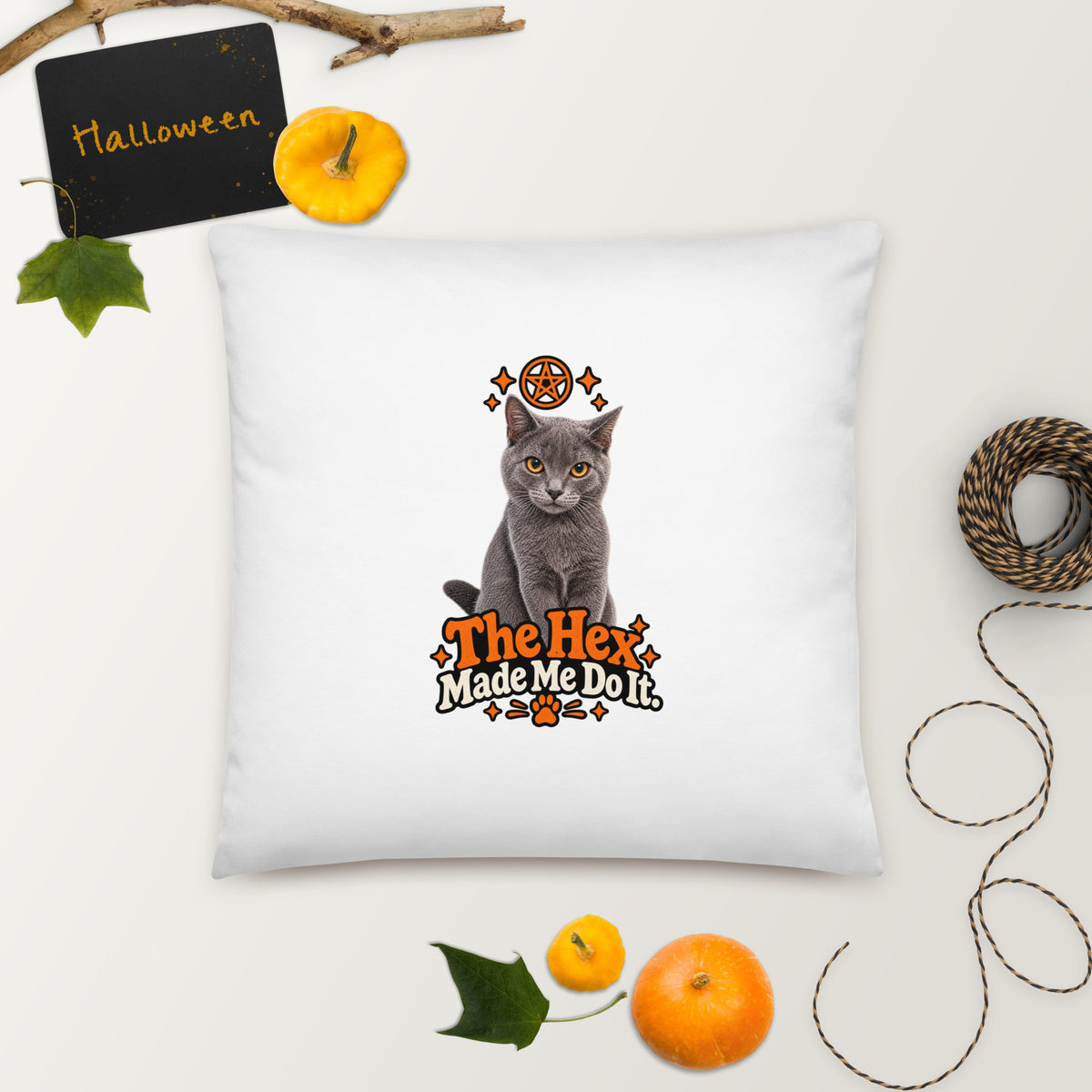Large square Uno the Cat Halloween pillow featuring a gray cat, orange pentagram, decorative stars, paw print, and “The Hex Made Me Do It” slogan.