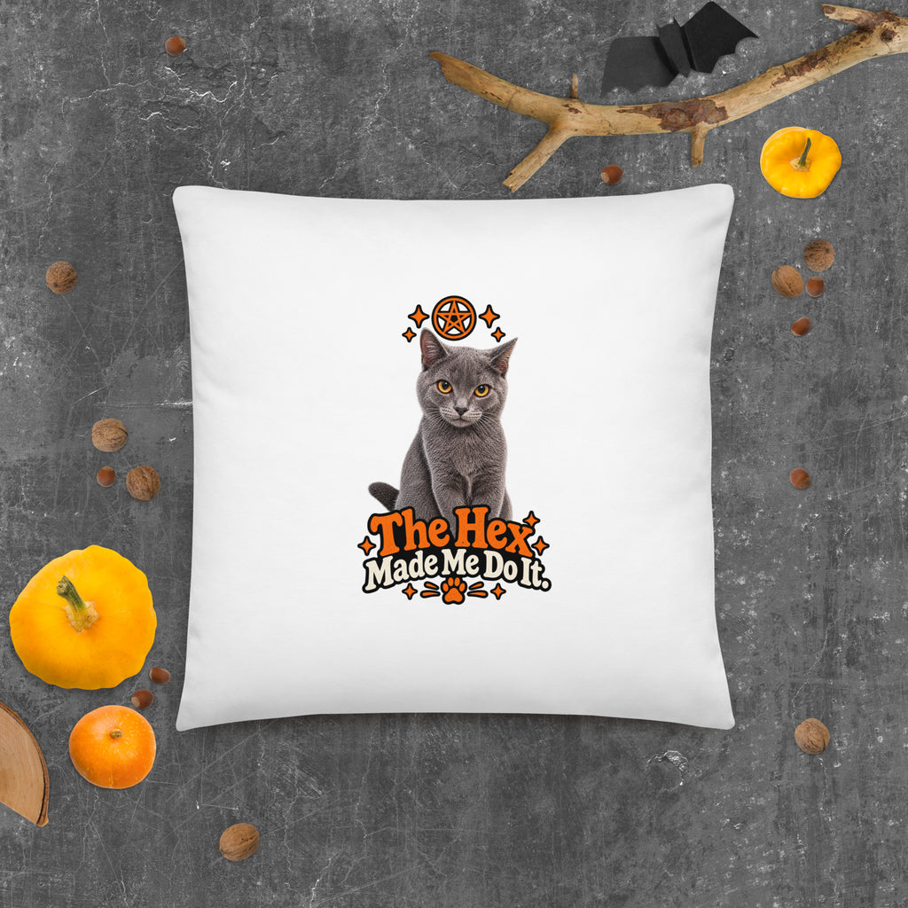 Large white Halloween throw pillow with Uno the Cat and orange Halloween lettering, shown against a dark textured backdrop with pumpkins.