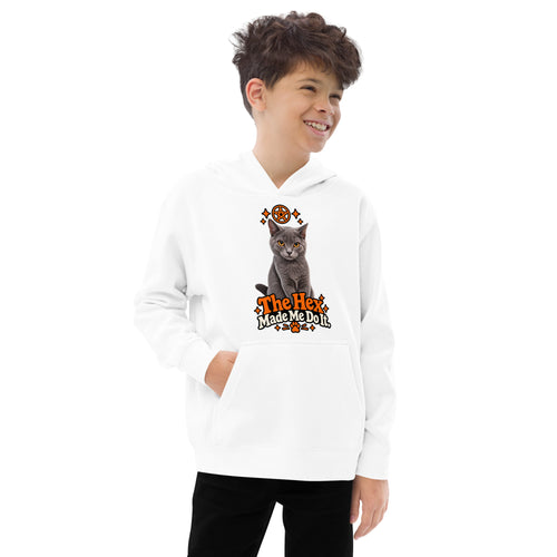 White youth Halloween cat hoodie with Uno's gray-cat artwork and orange “The Hex Made Me Do It” design, modeled in a relaxed front pose.