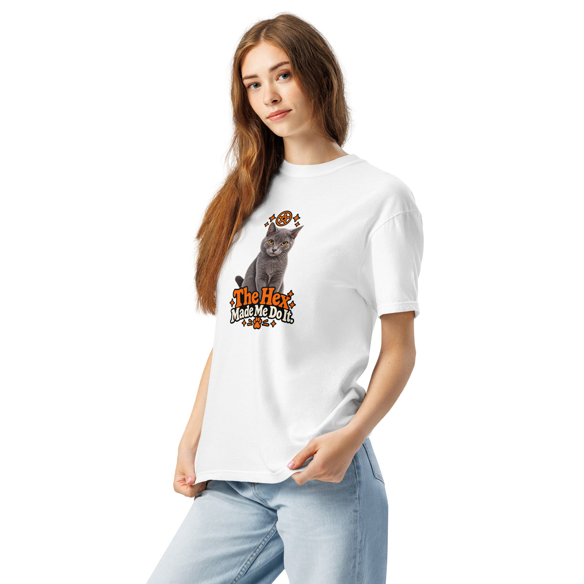 Angled view of the white Uno the Cat Halloween T-shirt showing its relaxed fit and orange-and-black “The Hex Made Me Do It” cat graphic.