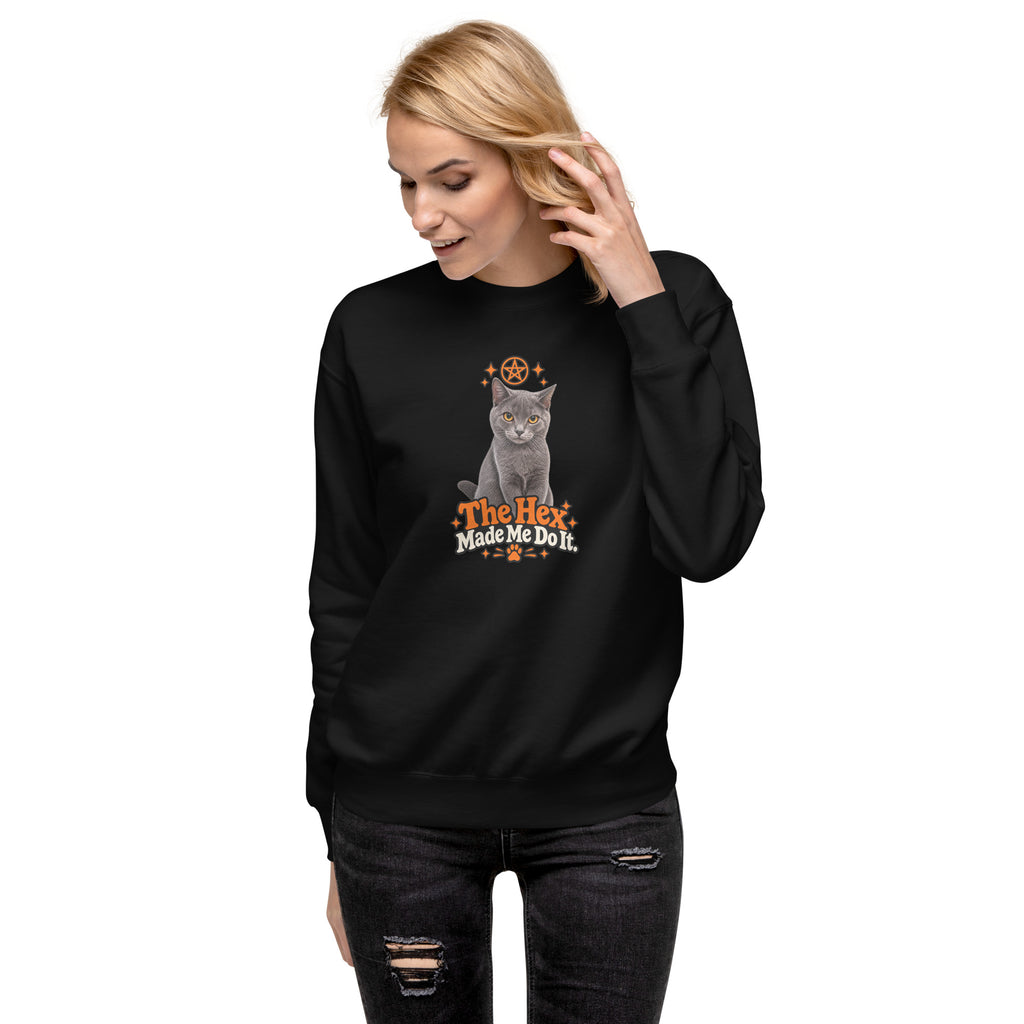 Black Uno the Cat Halloween sweatshirt with orange and white “The Hex Made Me Do It” design, shown from an angled front view.